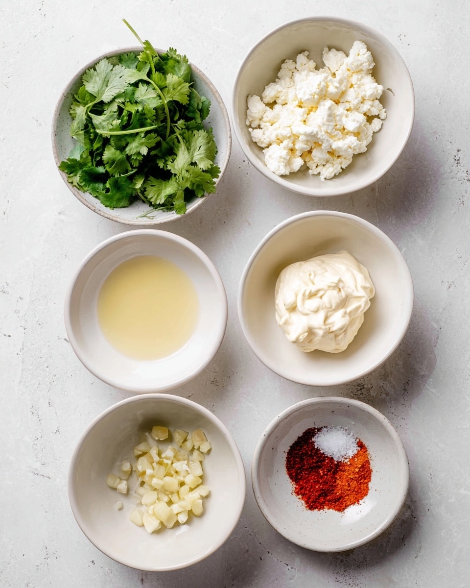 The image shows six white bowls placed on a white marbled surface. The top left bowl contains fresh green cilantro leaves with detailed leaf texture. Below it, the middle left bowl holds crumbled white cheese with a soft, slightly rough texture. The bottom left bowl has a small amount of light yellow liquid, smooth and reflective. In the center, a bowl contains creamy white mayonnaise, soft and thick in texture. On the top right bowl are small pieces of minced garlic with a pale yellow color and slightly chunky texture. The bottom right bowl contains a mix of red chili powder and white salt, finely powdered and neatly divided. photo taken with an iphone --ar 4:5 --v 7