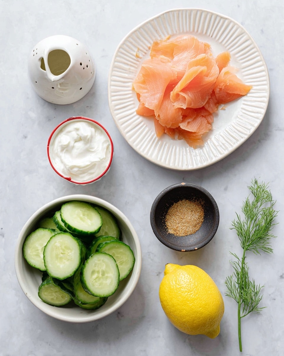 The image shows several food items arranged on a white marbled surface. At the center top, there is a white fluted plate with thin, pale pink slices of smoked salmon loosely layered on it. To the right of the plate, there is a small round black bowl with light brown seasoning and next to it a small white sauce jug with more seasoning. Below these, a small white bowl with a red rim holds a single dollop of white cream cheese or sour cream. To the left, a white bowl is filled with thick slices of bright green cucumber showing their pale interior seeds. In the bottom right corner, a whole bright yellow lemon sits next to a white ceramic salt shaker with three holes on top. A small sprig of fresh green dill lies between the seasoning jug and the cream cheese bowl. The photo taken with an iphone --ar 4:5 --v 7