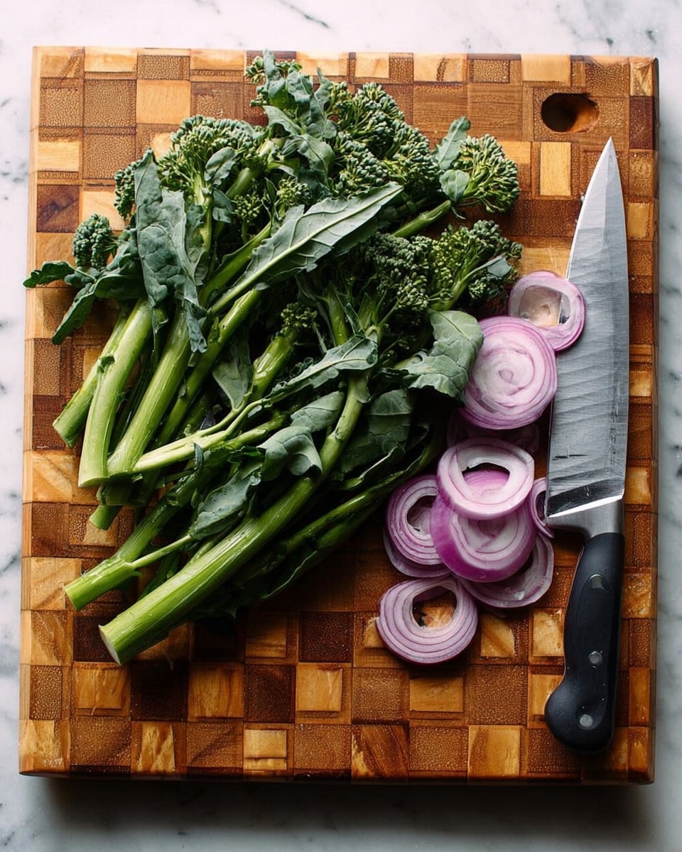 A wooden cutting board with a checkered pattern holds fresh green broccoli stems with leaves clustered on the left side, showing varied textures of smooth stems and bumpy florets. On the upper right corner, there are thin, circular slices of purple onion arranged loosely. A large knife with a silver blade and black handle lies diagonally on the board, with the blade pointing toward the top center. The board sits on a white marbled surface. photo taken with an iphone --ar 4:5 --v 7
