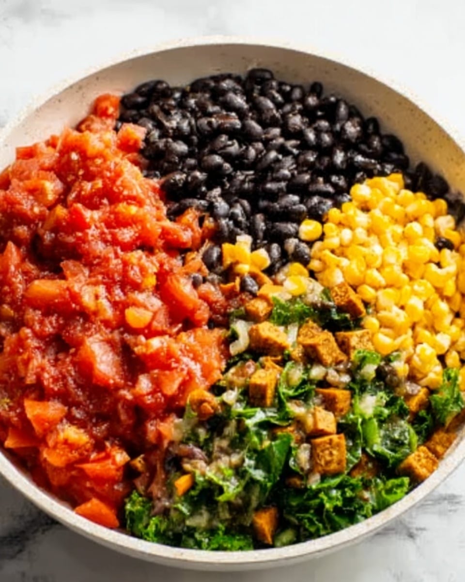 In a white bowl, there are four distinct layers of food placed side by side. The first layer is red diced tomatoes with a slightly wet texture. Next to it are cooked black beans, dark and shiny with a smooth surface. Beside the beans, there is a layer of yellow corn kernels, bright and dry looking. The last visible layer is green leafy vegetables mixed with small pieces of brown tofu, soft and slightly crumbly. The bowl is set on a white marbled surface. Photo taken with an iphone --ar 4:5 --v 7