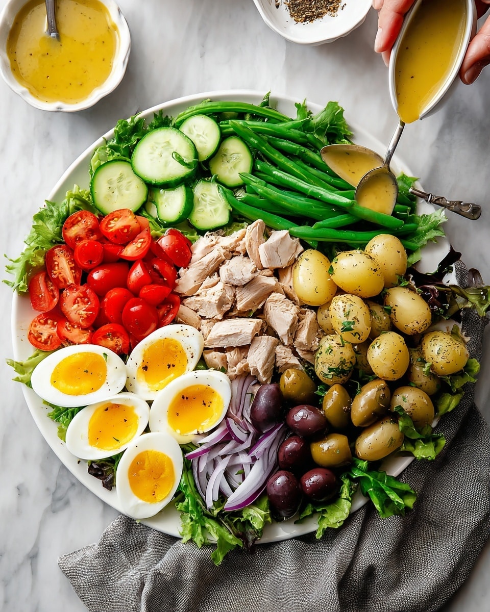 A white plate is full of many healthy foods arranged in sections over a bed of green leafy lettuce. Starting from the left, there are thin slices of cucumber in dark and light green colors, followed by bright red cherry tomatoes cut in halves, then flaky light beige cooked turkey pieces in the center. Above the turkey, there are four halves of soft-boiled eggs showing bright yellow yolks with some black pepper on top. To the right of the eggs, fresh dark green beans are lined up with a spoon pouring a yellow dressing on boiled small potatoes that show a mix of light brown and yellow colors. Below the potatoes, there is a mix of green and dark purple olives, sitting next to thin strips of pale purple onion. The plate sits on a white marbled surface with a gray cloth napkin beside it, and two white bowls with a yellowish dressing and pepper in the background. Woman's hand holds the spoon pouring the dressing. photo taken with an iphone --ar 4:5 --v 7