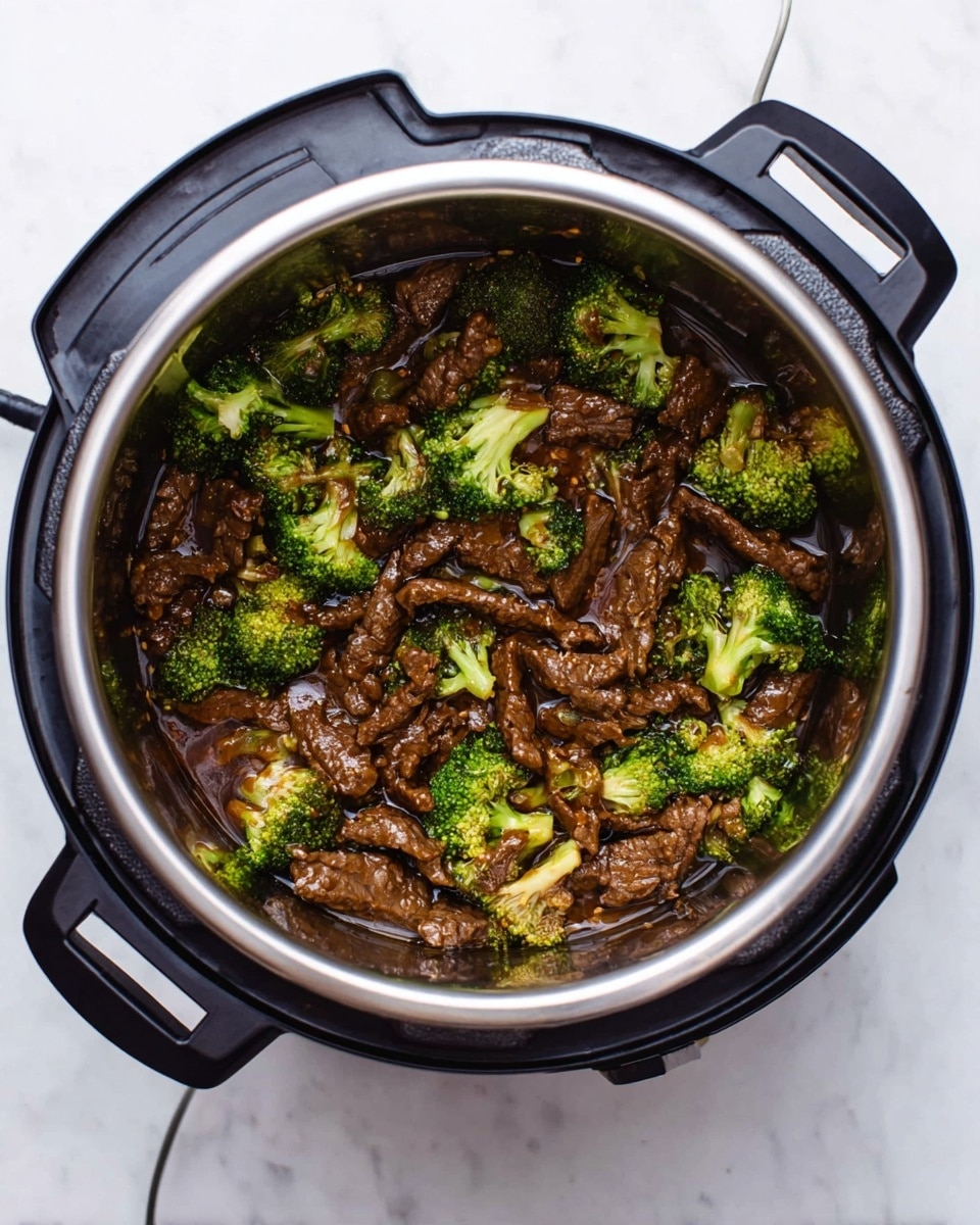 The image shows a black pot with cooked broccoli and pieces of brown meat inside a dark brown sauce. The broccoli florets are bright green and spread unevenly over the top of the dish, while the meat pieces are scattered underneath, partially covered by the sauce. The pot is placed on a white marbled surface, and part of the black lid is visible leaning to the right side. photo taken with an iphone --ar 4:5 --v 7
