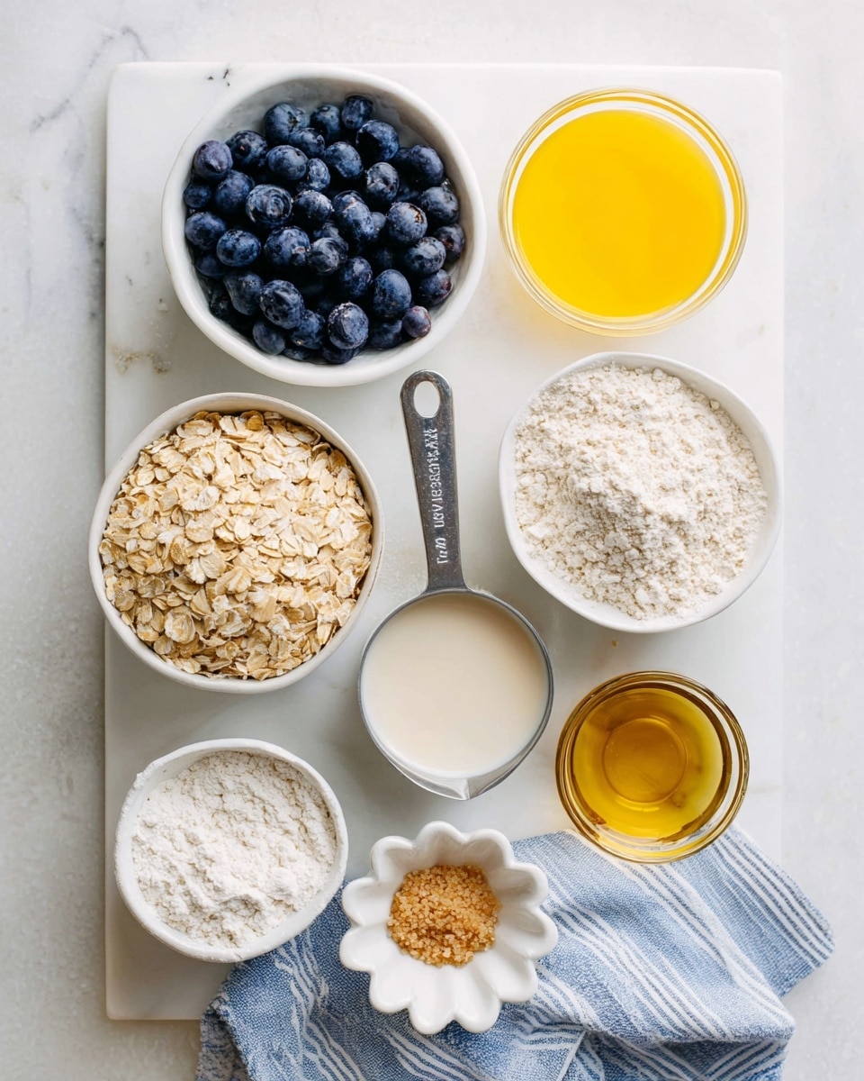 Top view of eight containers with ingredients on a white marbled surface. At top left is a white bowl filled with dark blue, round blueberries. To its right is a clear glass cup with bright yellow melted butter. Below the blueberries is a clear glass measuring cup with light beige milk inside. In the center is a metal measuring cup filled with light brown rolled oats. To the right of the oats is a white bowl with a light tan powder, likely sugar. Below the milk is a white bowl with white flour. At bottom center is a small white, flower-shaped dish with small light brown granules, possibly brown sugar. To the right of the sugar is a clear glass bowl with golden yellow oil. A blue and white striped kitchen towel is under the milk cup. photo taken with an iphone --ar 4:5 --v 7