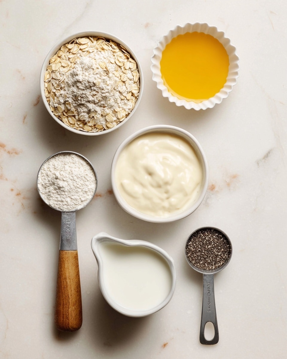 The image shows six separate small containers placed on a white marbled surface. At the top right, there is a small white ruffled bowl filled with a smooth, golden yellow liquid. Below it to the right is a white bowl filled with a creamy white yogurt-like substance, smooth and thick. To its left is a round white bowl filled with fine, powdery white flour. Below the flour sits a white container with a spout, filled with a white liquid resembling milk. To the far left, a metal measuring cup with a wooden handle holds dry rolled oats with a light beige color and rough texture, and on the far right, another metal measuring cup with a wooden handle contains small, black chia seeds with a slightly shiny surface. The containers are evenly spaced, creating a neat arrangement. Photo taken with an iphone --ar 4:5 --v 7