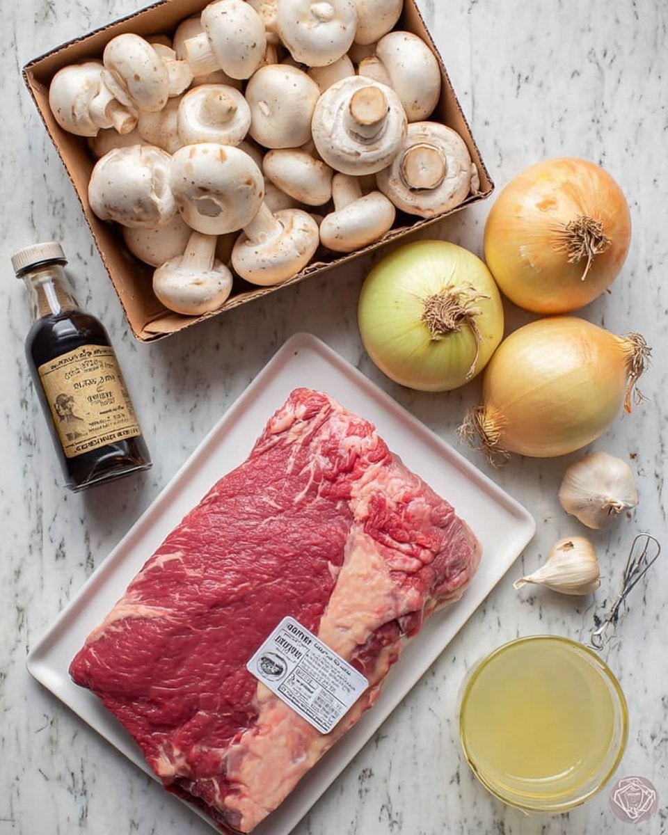 The image shows a flat white tray holding a large piece of raw meat with visible marbling and a label, placed on a white marbled surface. Above the meat, there is an open small cardboard box filled with whole white mushrooms with smooth caps. To the right of the mushrooms, two whole yellow onions with dry stems are placed side by side. Below the onions, three garlic bulbs with some cloves visible sit close together. Next to the garlic, there is a small dark bottle of Worcestershire sauce with a beige label and black cap. In the bottom right corner, a clear glass filled with a pale yellow liquid and a spoon inside is partially visible. The whole arrangement rests on a white marbled texture background. photo taken with an iphone --ar 4:5 --v 7