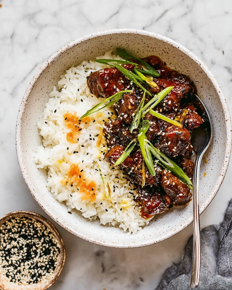 This image shows a white speckled bowl filled with two main layers. The bottom layer is a bed of fluffy white rice with some small orange spots, giving it a slightly mixed look. On top of the rice, there is a layer of dark brown pieces of meat covered in a sticky reddish-brown sauce. Thin green slices of scallions are placed on the meat, adding a fresh touch. White and black sesame seeds are sprinkled over the dish. A silver fork is resting inside the bowl, leaning against the side. The bowl is set on a surface with a white marbled texture. Nearby, a small bowl holds a mix of black and white sesame seeds. Photo taken with an iphone --ar 4:5 --v 7