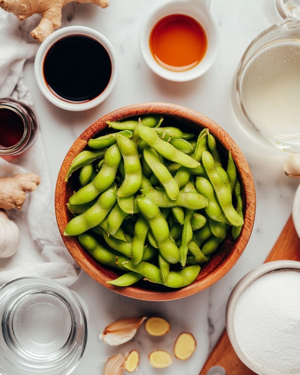 A wooden bowl is filled with bright green edamame pods, full and fresh, placed in the center on a white marbled surface. Around the bowl, there are small white bowls and containers with various ingredients: one with dark soy sauce, another with a light brown sauce, a small clear glass of water, and a white bowl full of white powdery substance. There are also pieces of light-colored ginger and garlic cloves scattered near the bowls. The scene shows a close and bright look, giving a fresh and clean feeling. photo taken with an iphone --ar 4:5 --v 7