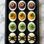 Halloween Deviled Eggs with Spooky, Pumpkin, Eyeball, and Spider Decorations Recipe